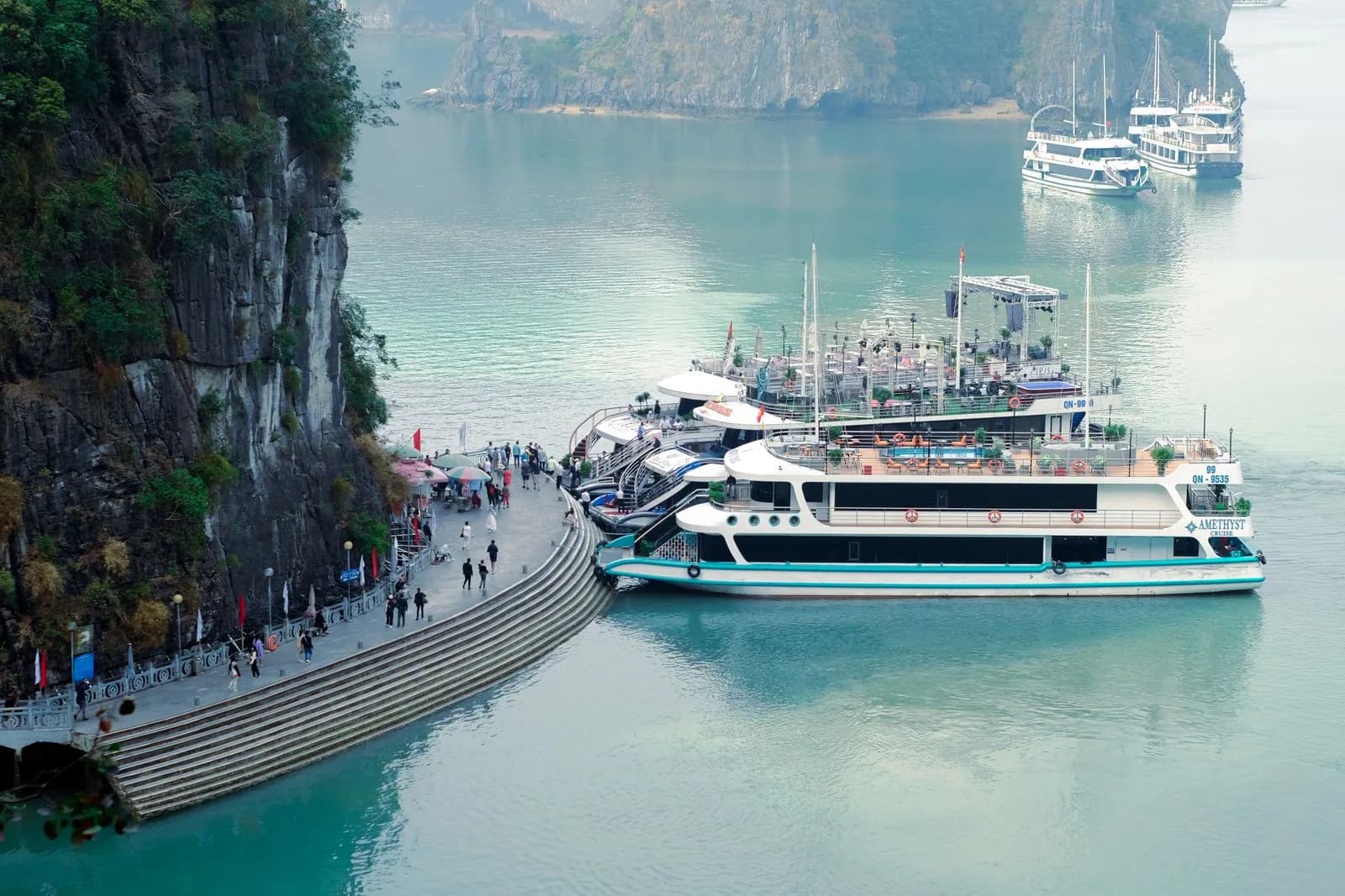 Boats at Hạ Long Bay in a stock image; no operator is represented